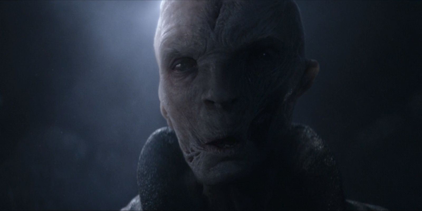 A hologram of Supreme Leader Snoke, played by Andy Serkis, looks down in Star Wars: The Force Awakens.