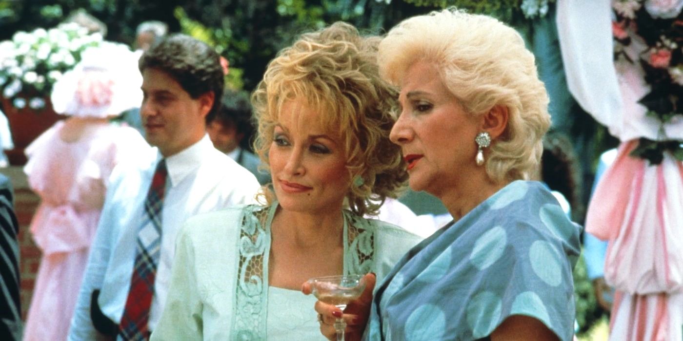 Dolly Parton and Olympia Dukakais gossip at an outdoor event in Steel Magnolias.
