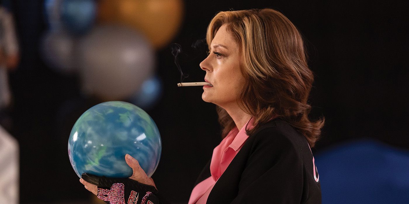 Susan Sarandon holding a bowling ball and smoking a cigarette in The Gutter