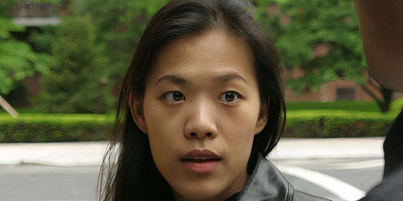 A young Asian woman looking at someone off-camera in Take Out