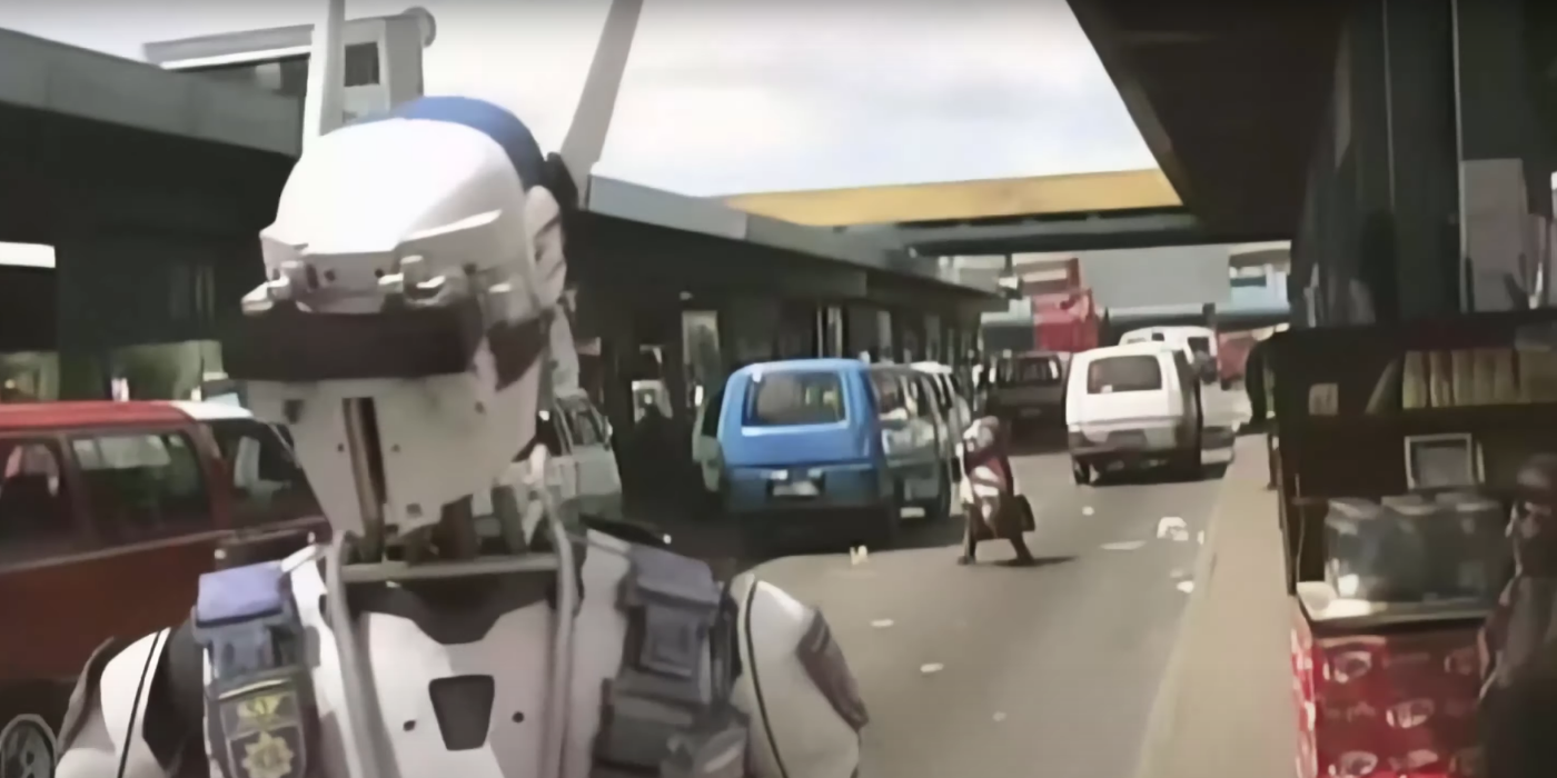 A robot police officer on a busy street in South Africa from Neill Blomkamp's short film?Tetra Vaal.