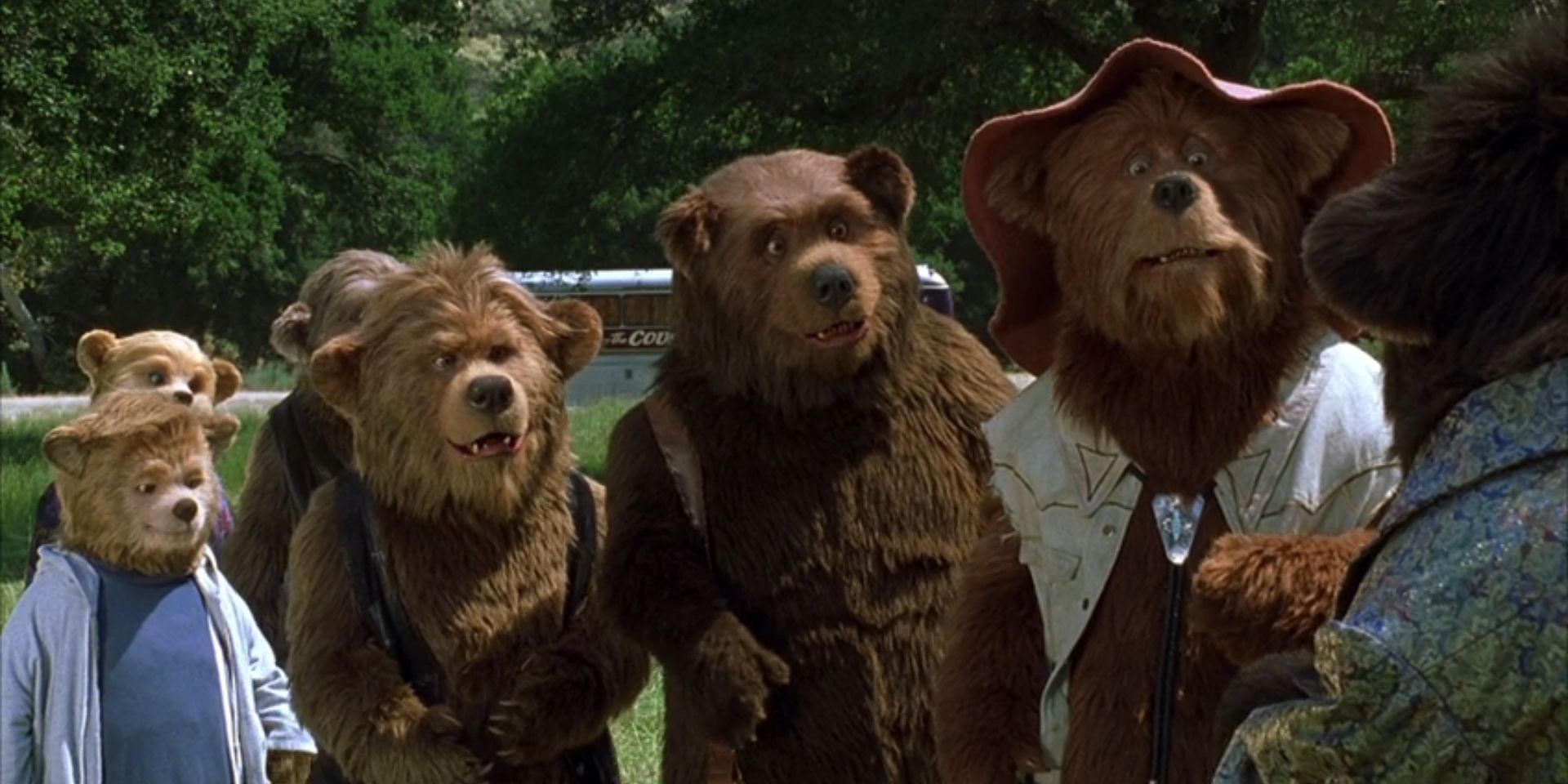 The Country Bears all stand in a field while baring a variety of expressions in 'The Country Bears'.