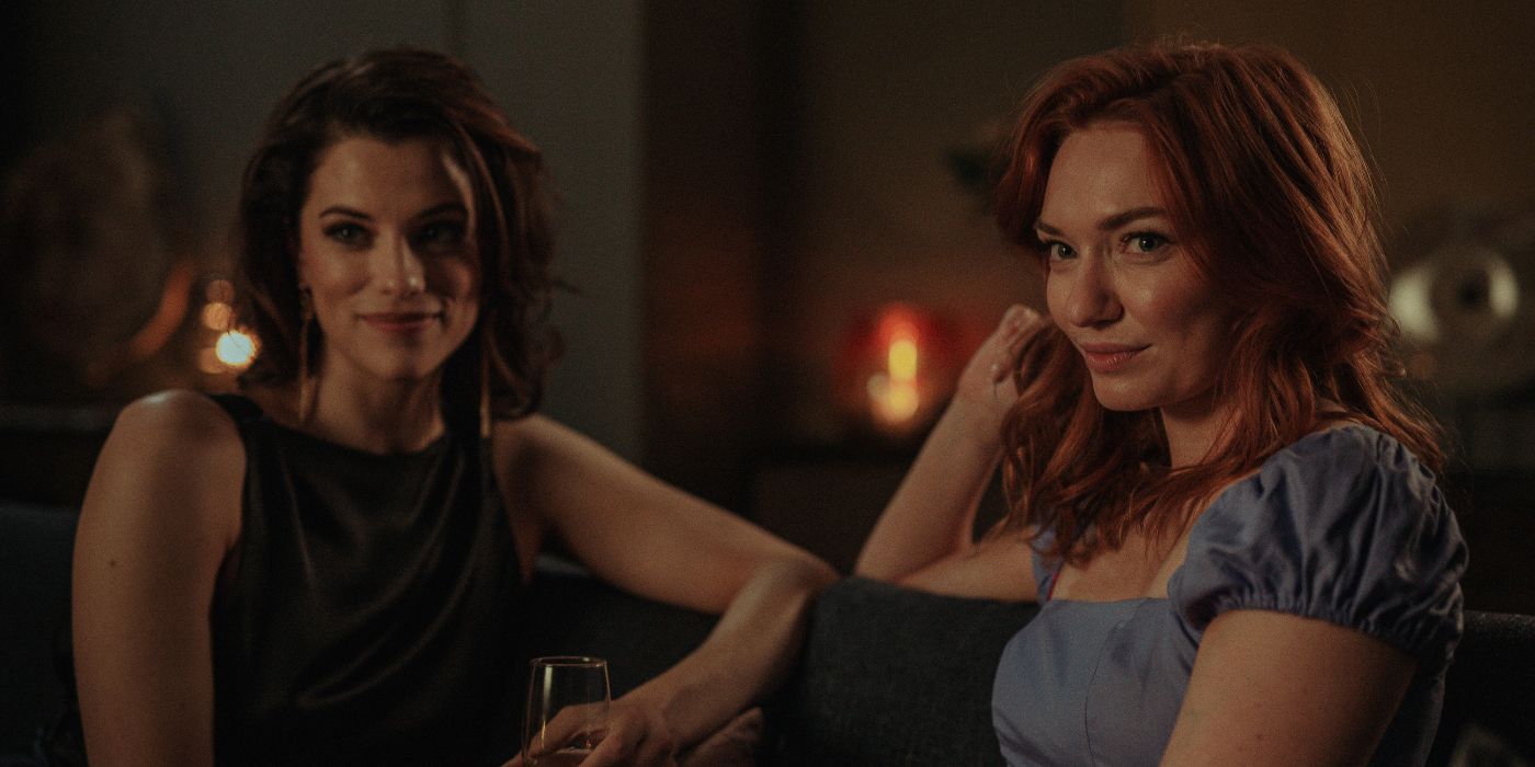 Eleanor Tomlinson and Jessica de Gouw sitting on a couch together