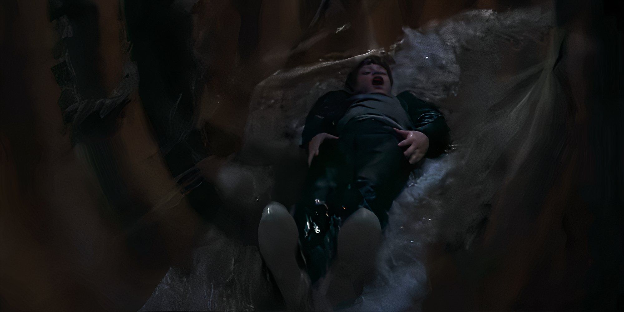 Mikey (Sean Astin) falling down a trap water slide in The Goonies​​​​​​​.