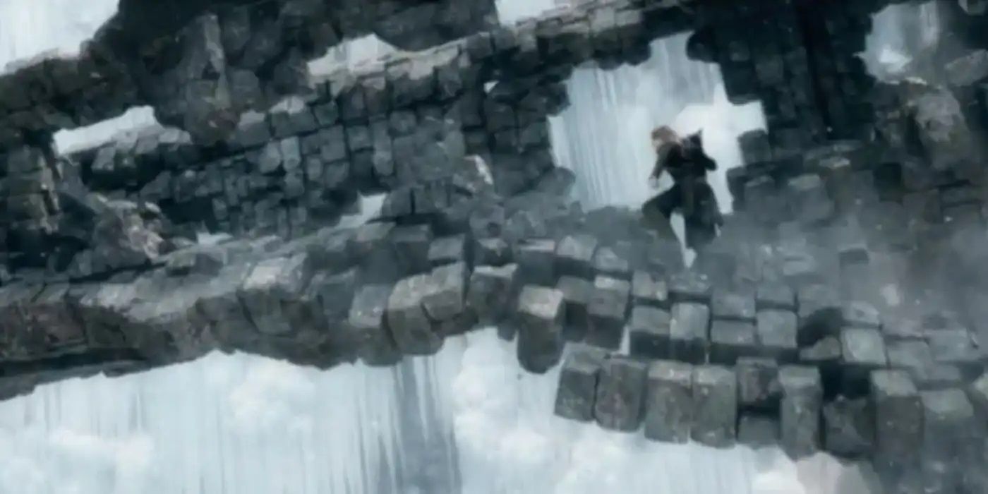 Legolas runs across a crumbling tower in The Hobbit: The Battle of the Five Armies.