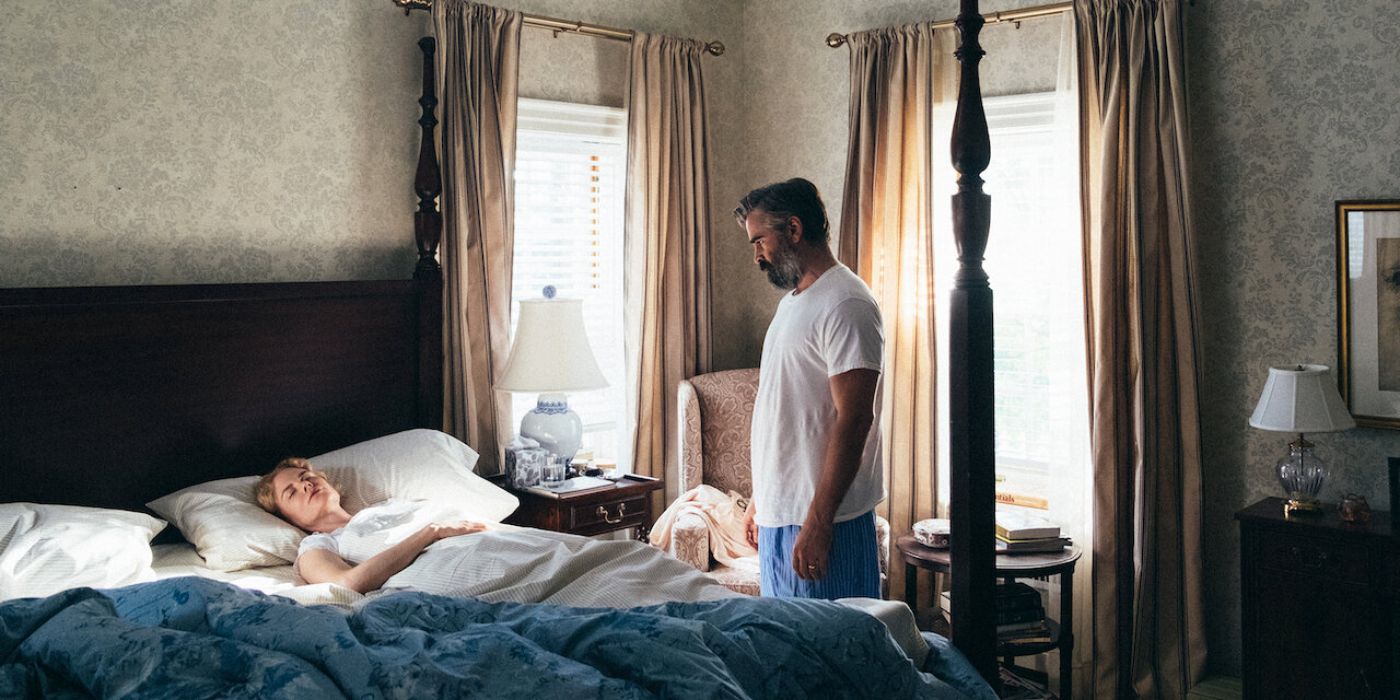 Colin Farrell looking down at a sleeping Nicole Kidman in &lsquo;The Killing of a Sacred Deer&rsquo;