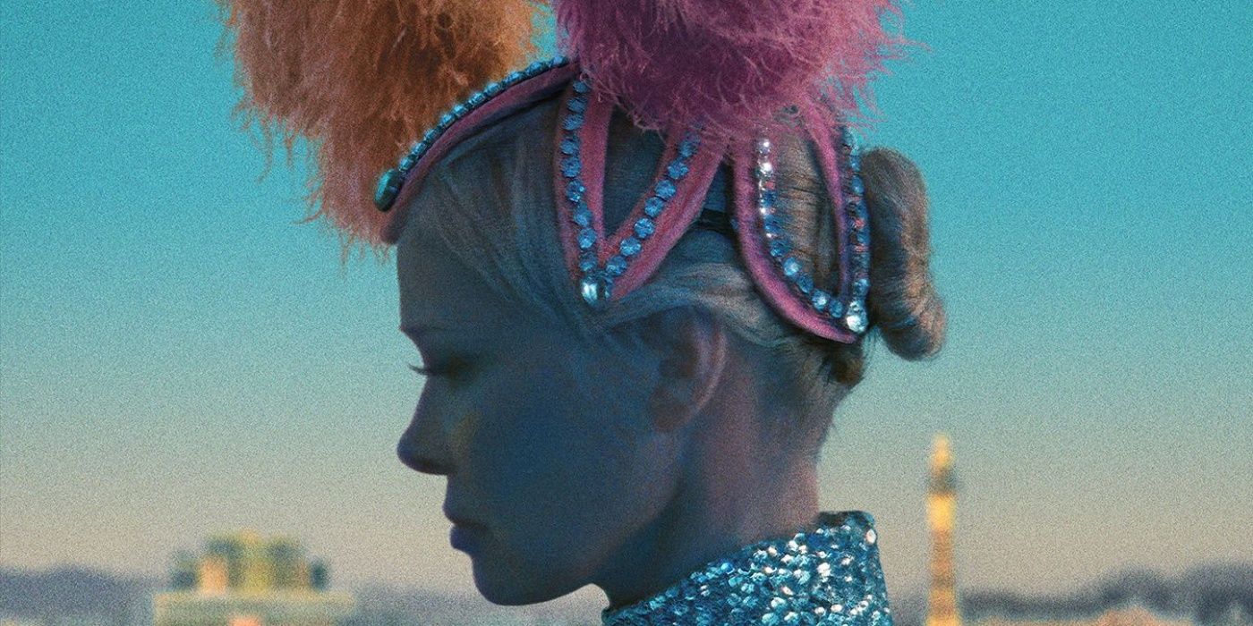 Pamela Anderson as Shelly in profile wearing a pink and orange feather headdress in The Last Showgirl