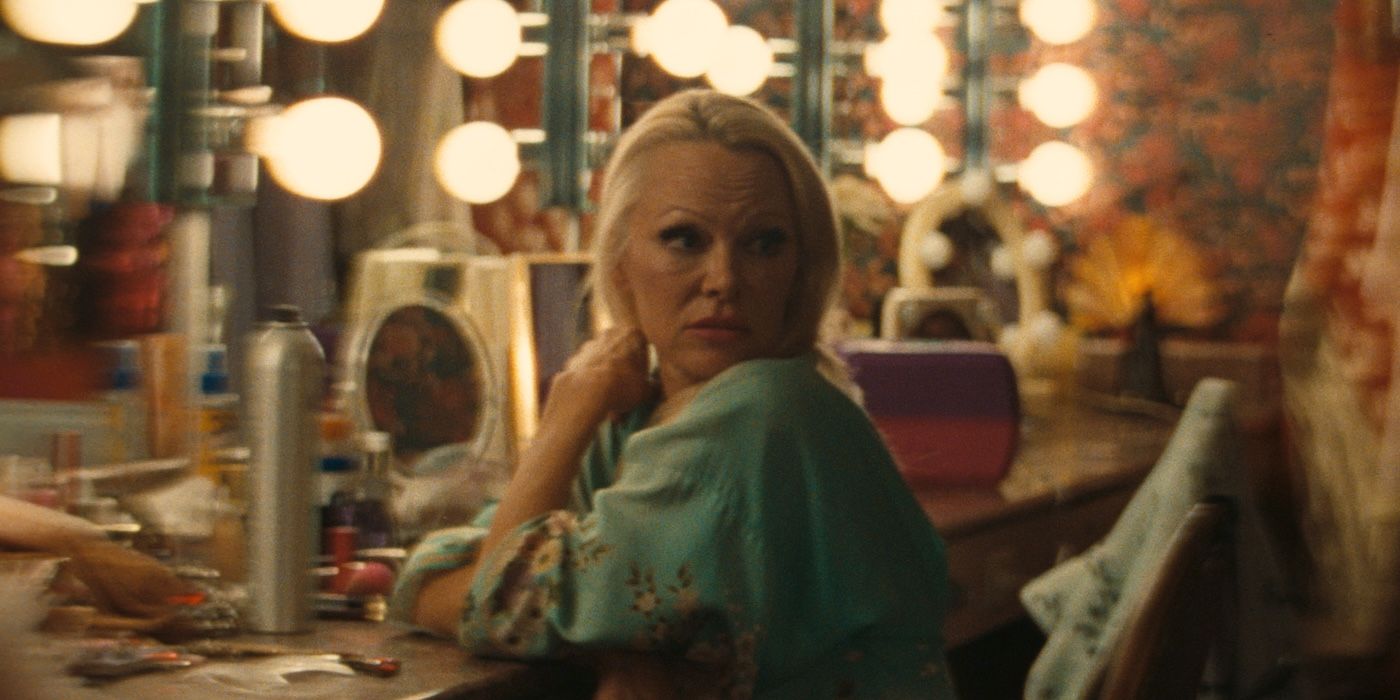 Pamela Anderson as Shelly sitting backstage at her dressing room mirror in The Last Showgirl