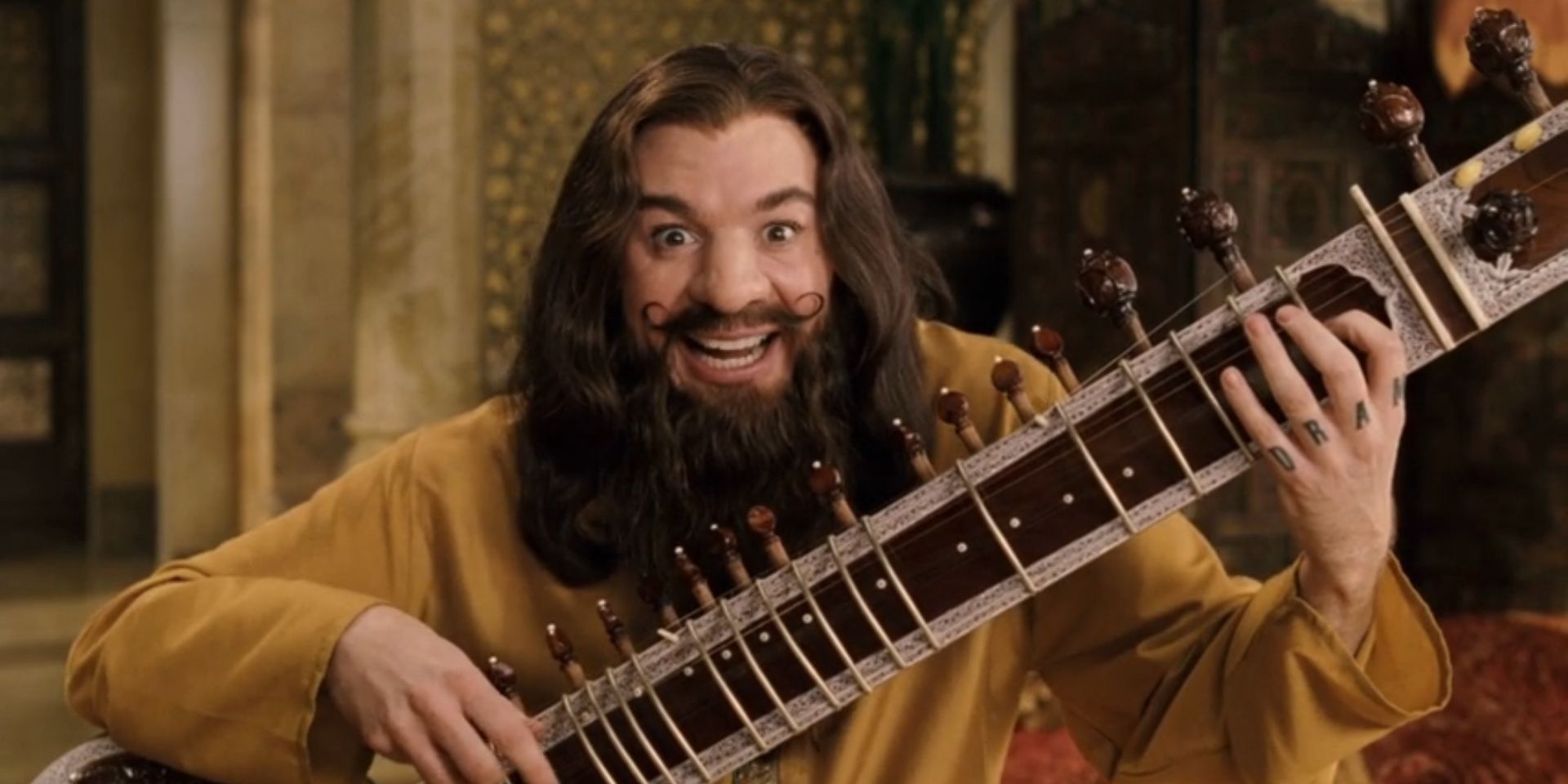 Guru Maurice Pitka, played by Mike Myers, holds a sitar in &lsquo;The Love Guru&rsquo;.