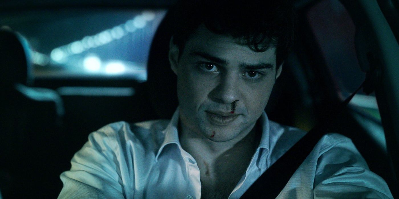 Noah Centineo as Owen driving with a bloody nose in 'The Recruit'