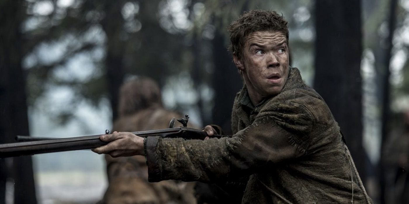 Will Poulter as Jim Bridger with a gun in 'The Revenant'