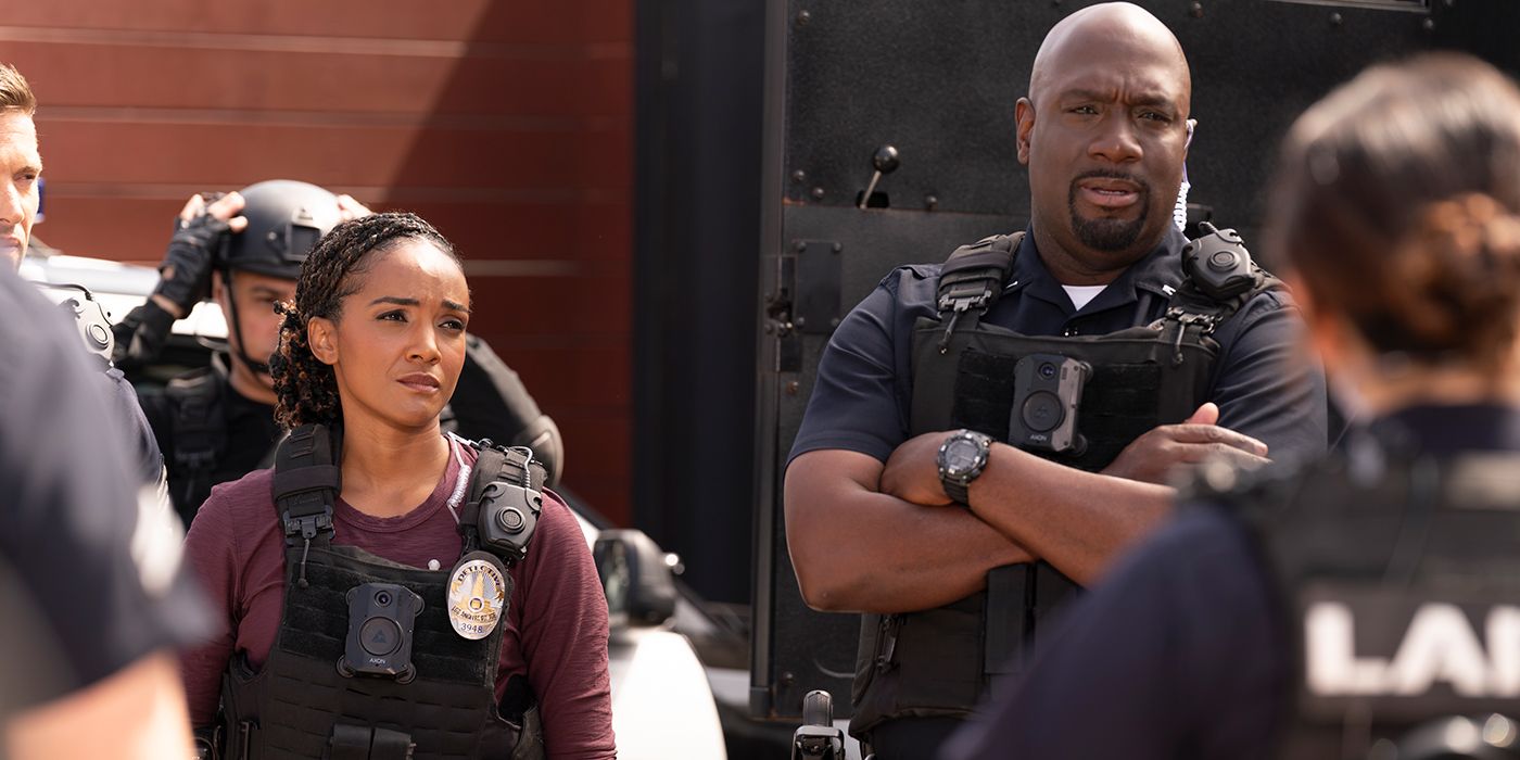 Mekia Cox as Nyla Harper and Richard T. Jones as Wade Grey standing next to each other in full uniform in The Rookie