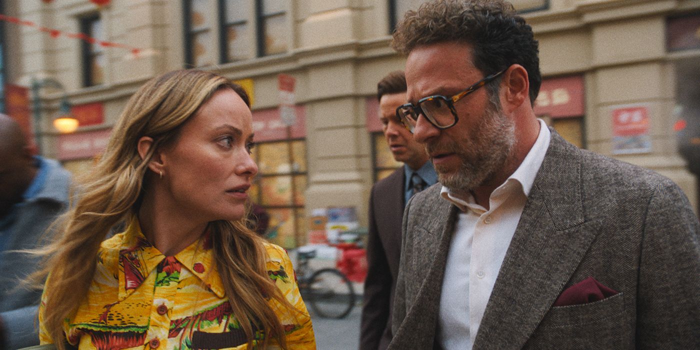 Olivia Wilde and Seth Rogen walking down the street looking at one another, worried, in The Studio.