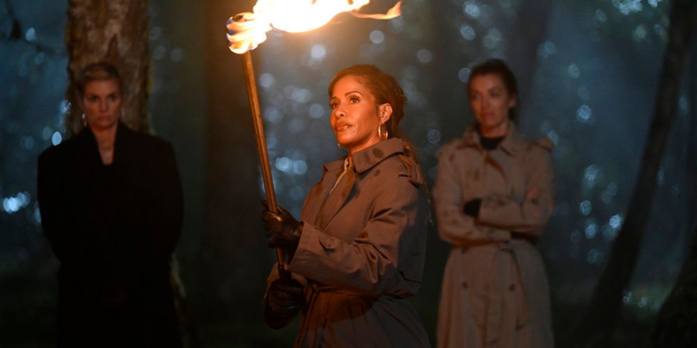 Sheree Whitfield holding a torch on &lsquo;The Traitors&rsquo; Season 2.