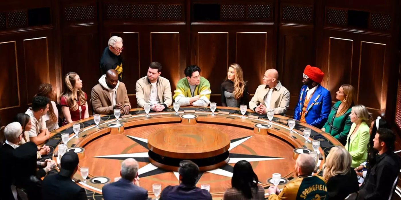 'The Traitors' cast members sitting around the Roundtable listening to Alan Cumming