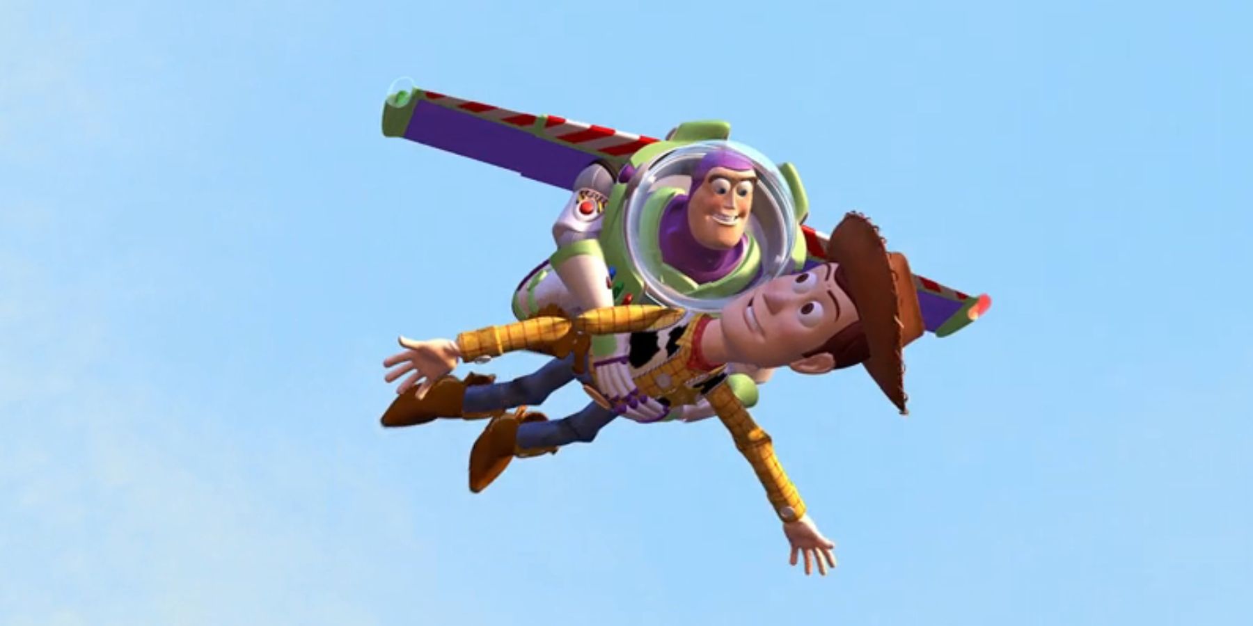 Buzz, voiced by Tim Allen, holds Woody, voiced by Tom Hanks, as they fly through the air in 'Toy Story'.