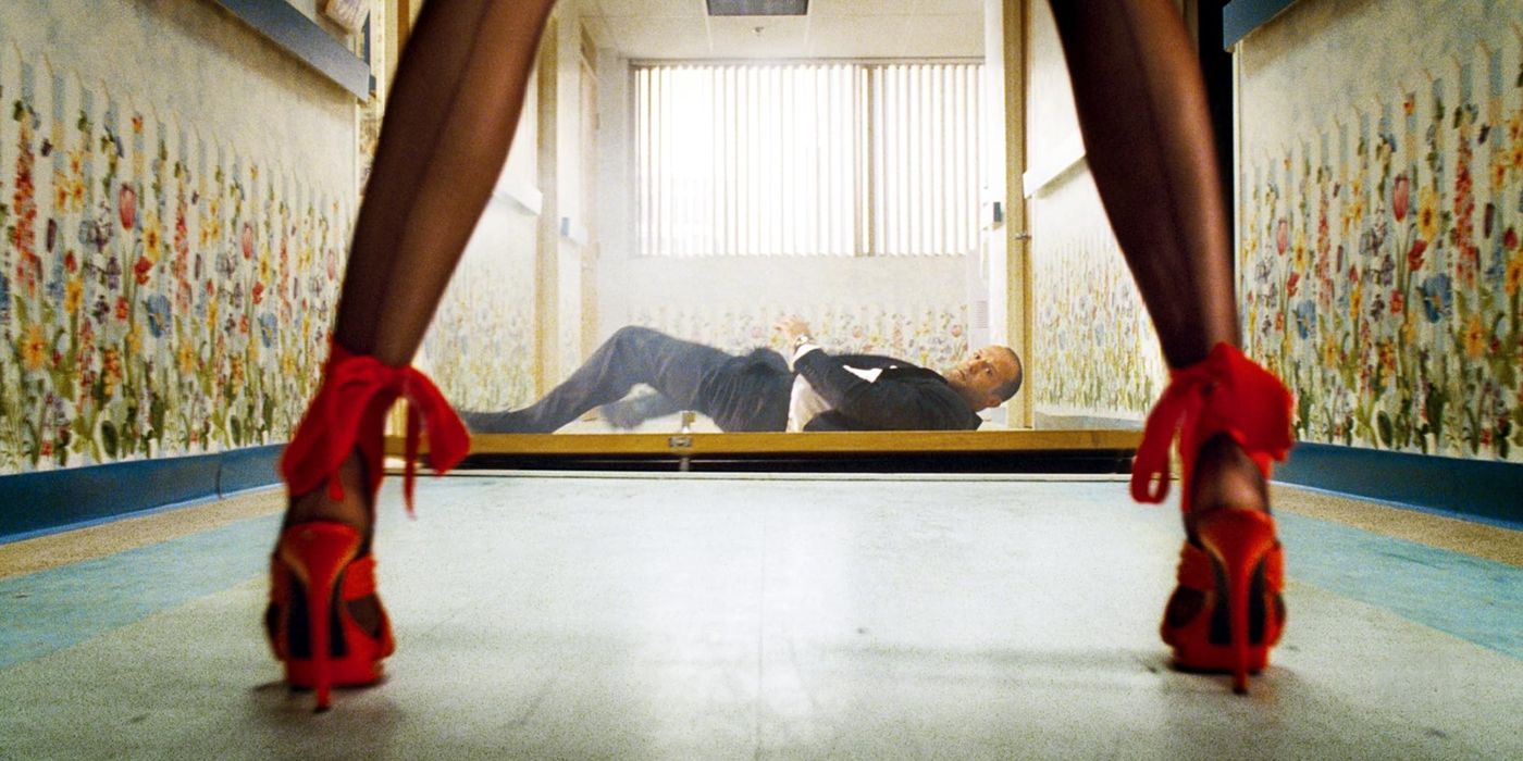 Jason Statham lies on a broken door in Transporter 2