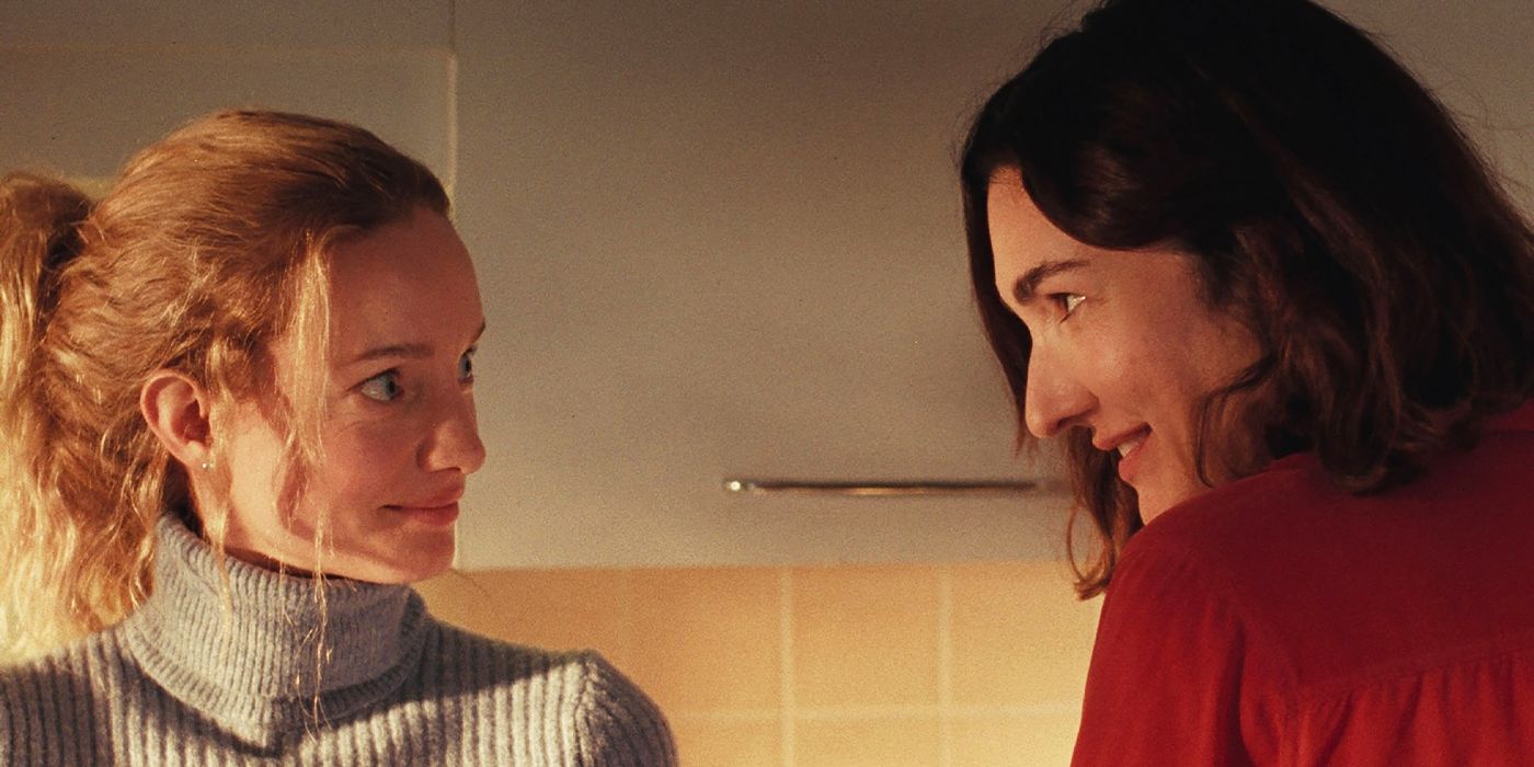 Violette (Laurence Lebouef) and Florence (Karine Gonthier-Hyndman) smiling at each other in Two Women