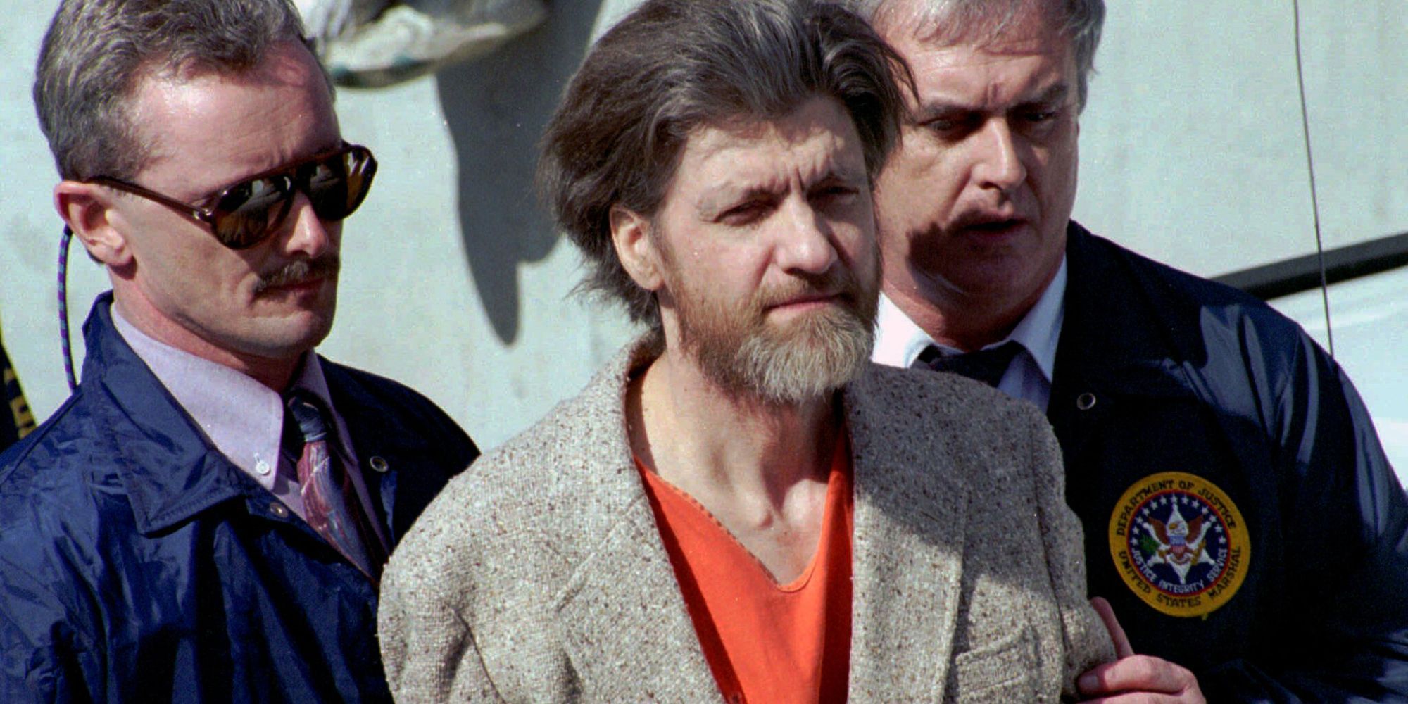 Ted Kaczynski being escorted by federal agents in Netflix&rsquo;s Unabomber- In His Own Words