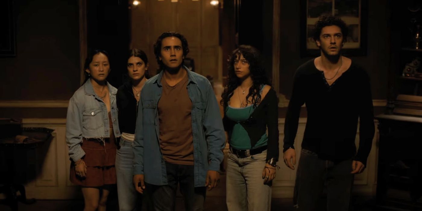 The cast of Until Dawn looking off camera scared in Until Dawn