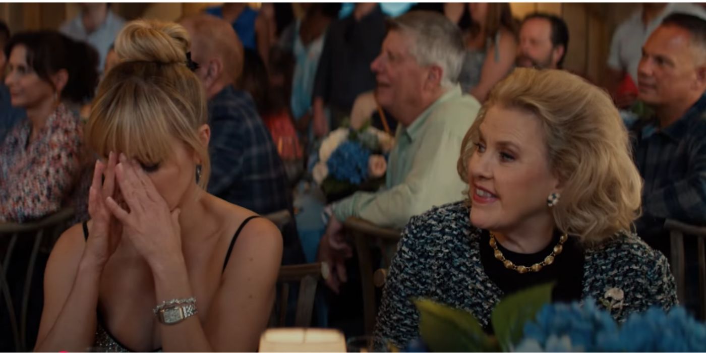 Celia Weston sitting next to Reese Witherspoon in &lsquo;You&rsquo;re Cordially Invited&rsquo;.