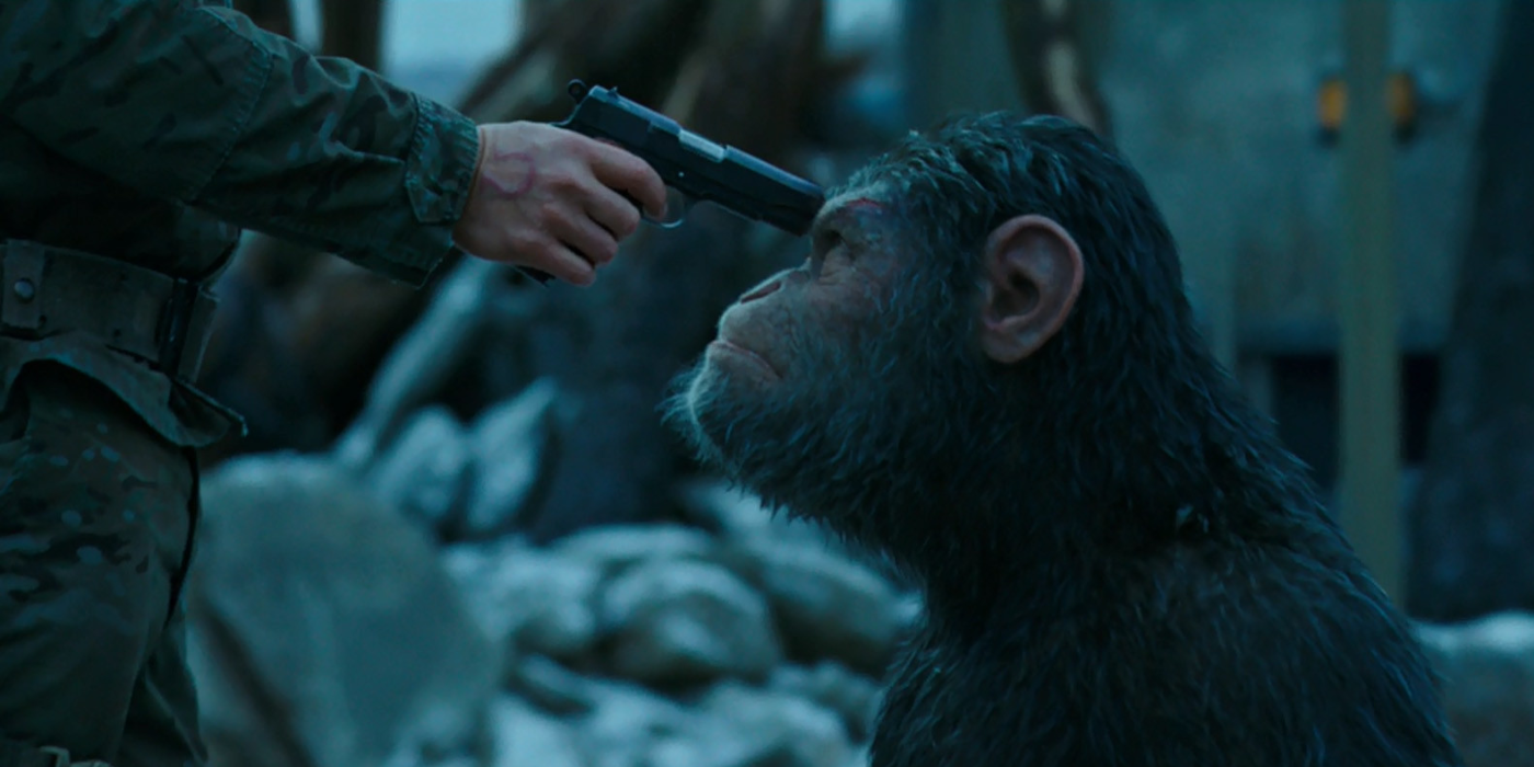 Caesar (Andy Serkis) is being held at gunpoint in War of the Planet of the Apes (2017)