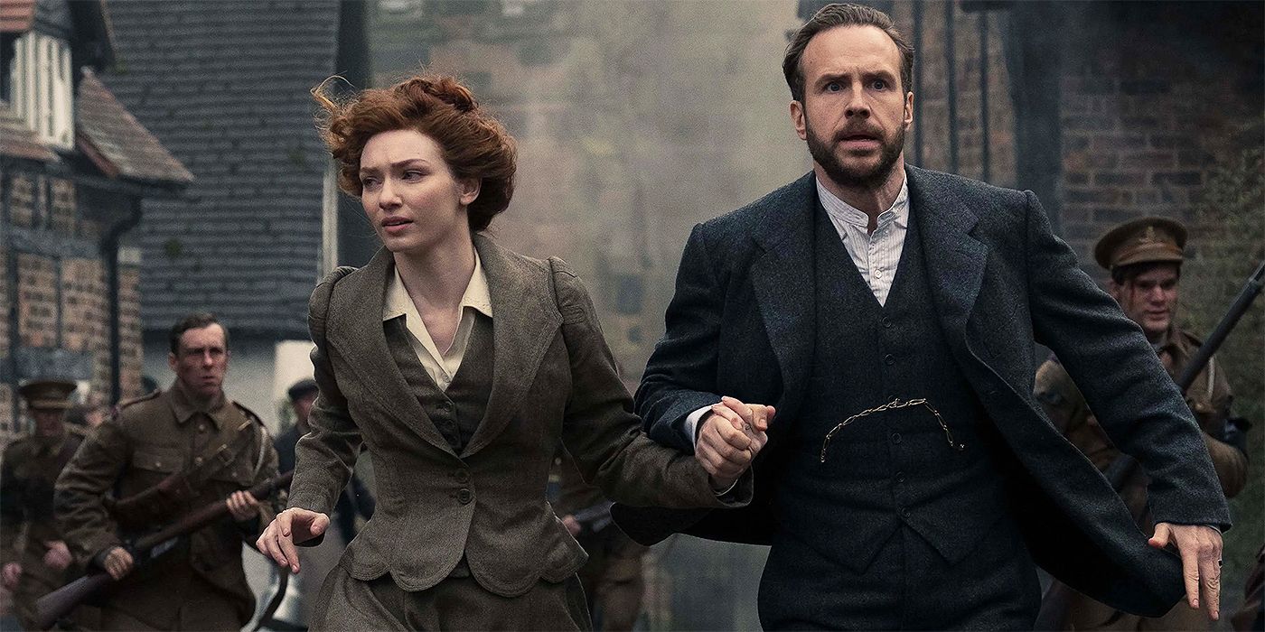 Rafe Spall and Eleanor Tomlinson holding hands while running in The War of the Worlds