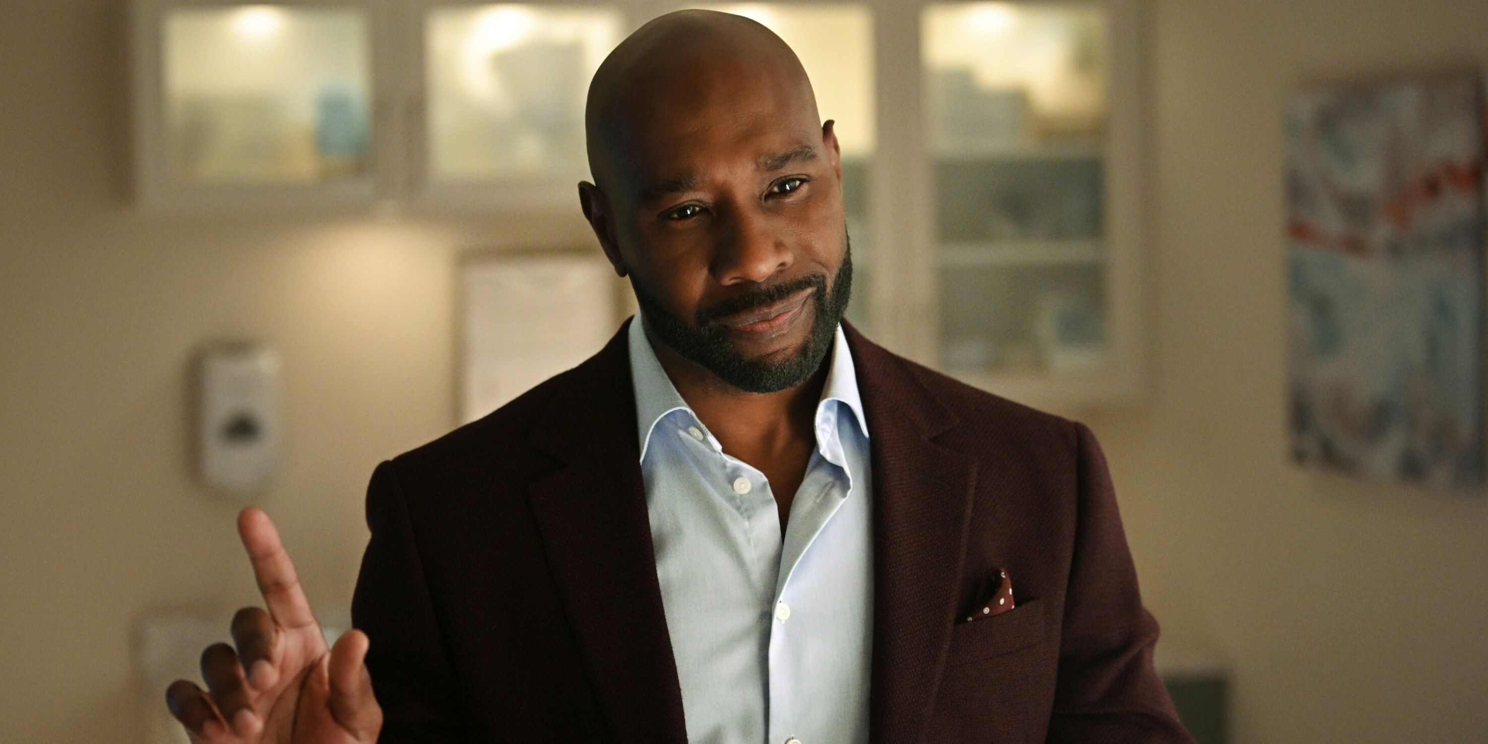 Morris Chestnut as Dr. Watson with his right index finger pointing up in the CBS series Watson