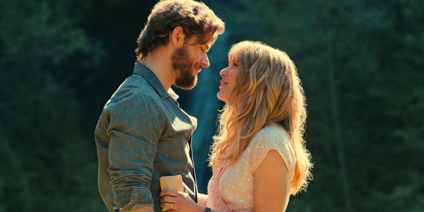 Young Everett and Sarah embracing while standing in stunning nature in 'Virgin River' season 6