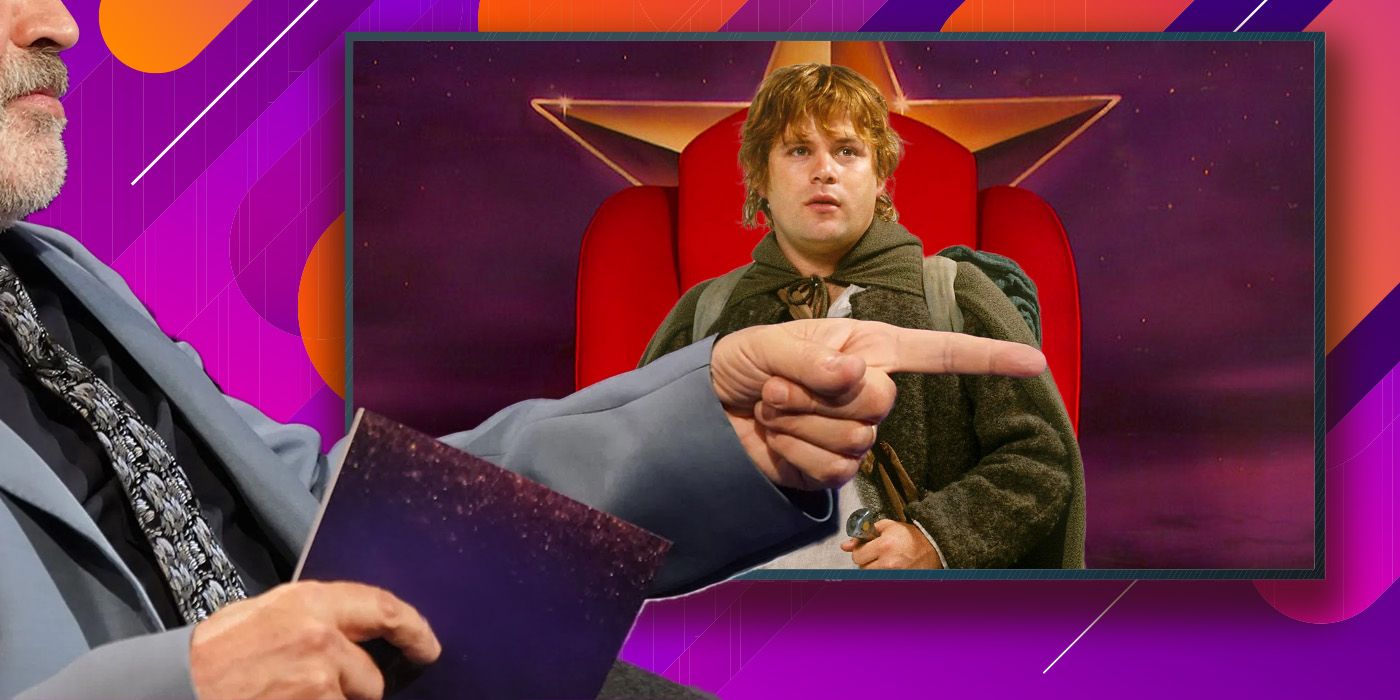 TV host Graham Norton, with his face obscured, sat in his studio holding cue cards while pointing at a screen with Samwise Gamgee on it.