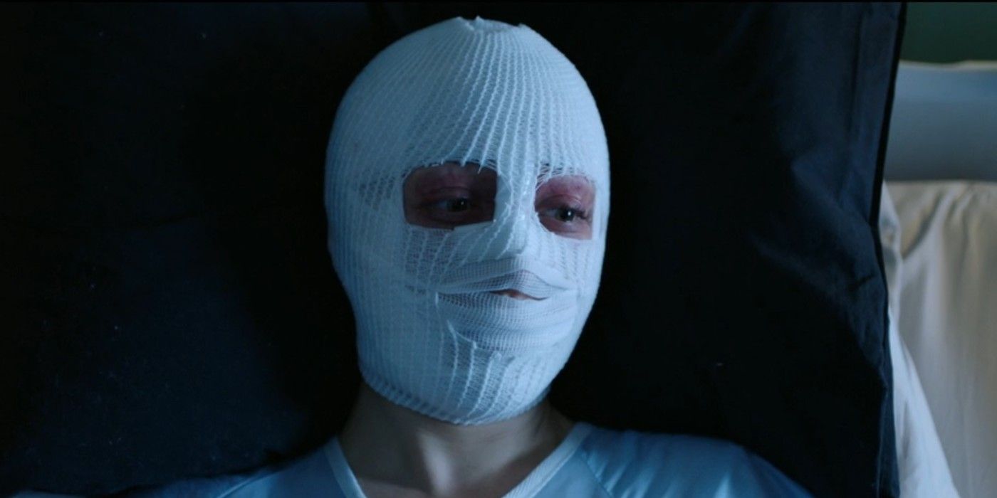 Zarah Mahler as Anna in &lsquo;Nightmare Cinema&rsquo; lying in a bed with her face covered in white bandages
