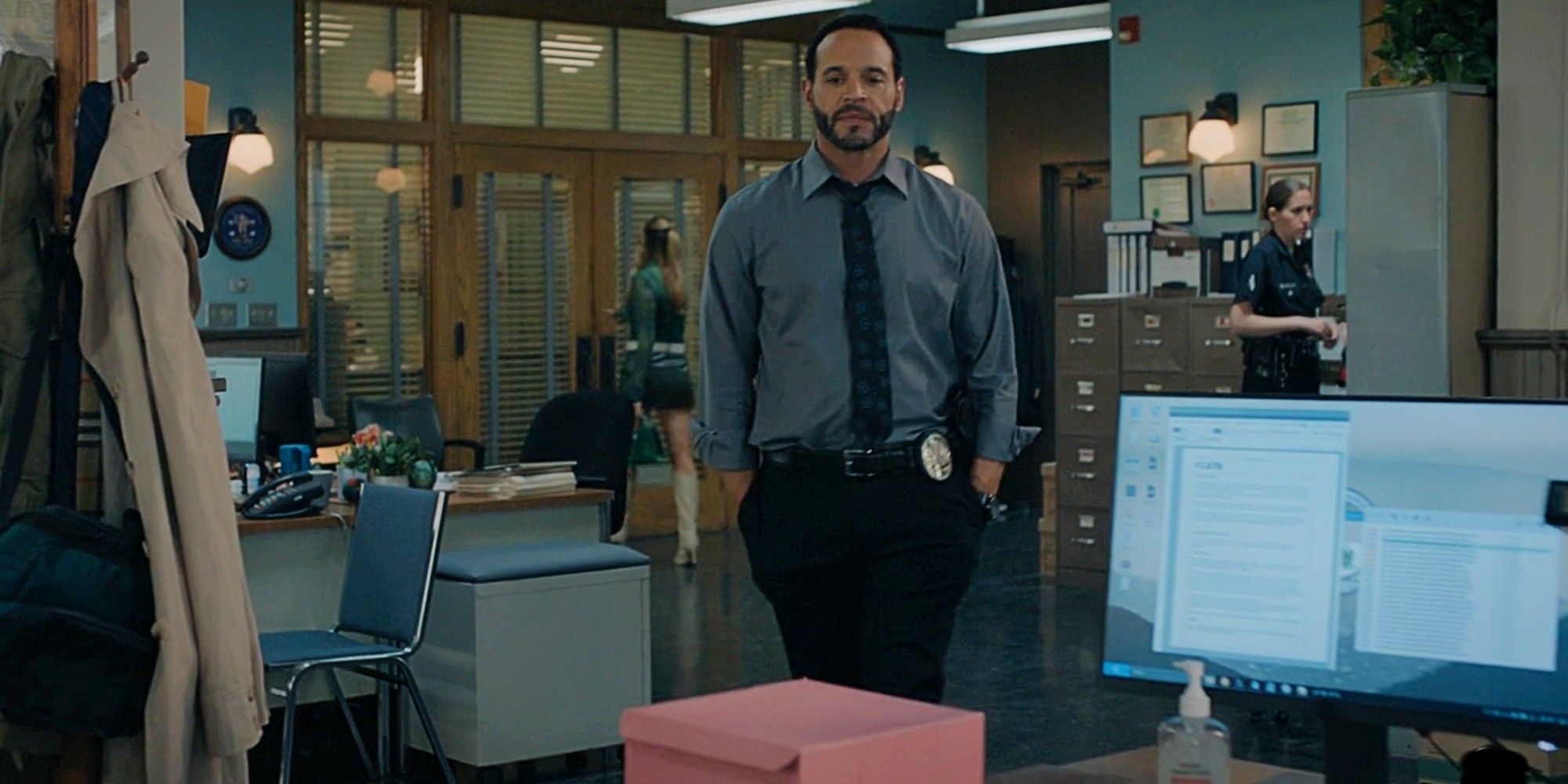 Karadec looking at a pink box on his desk in High Potential Season 1