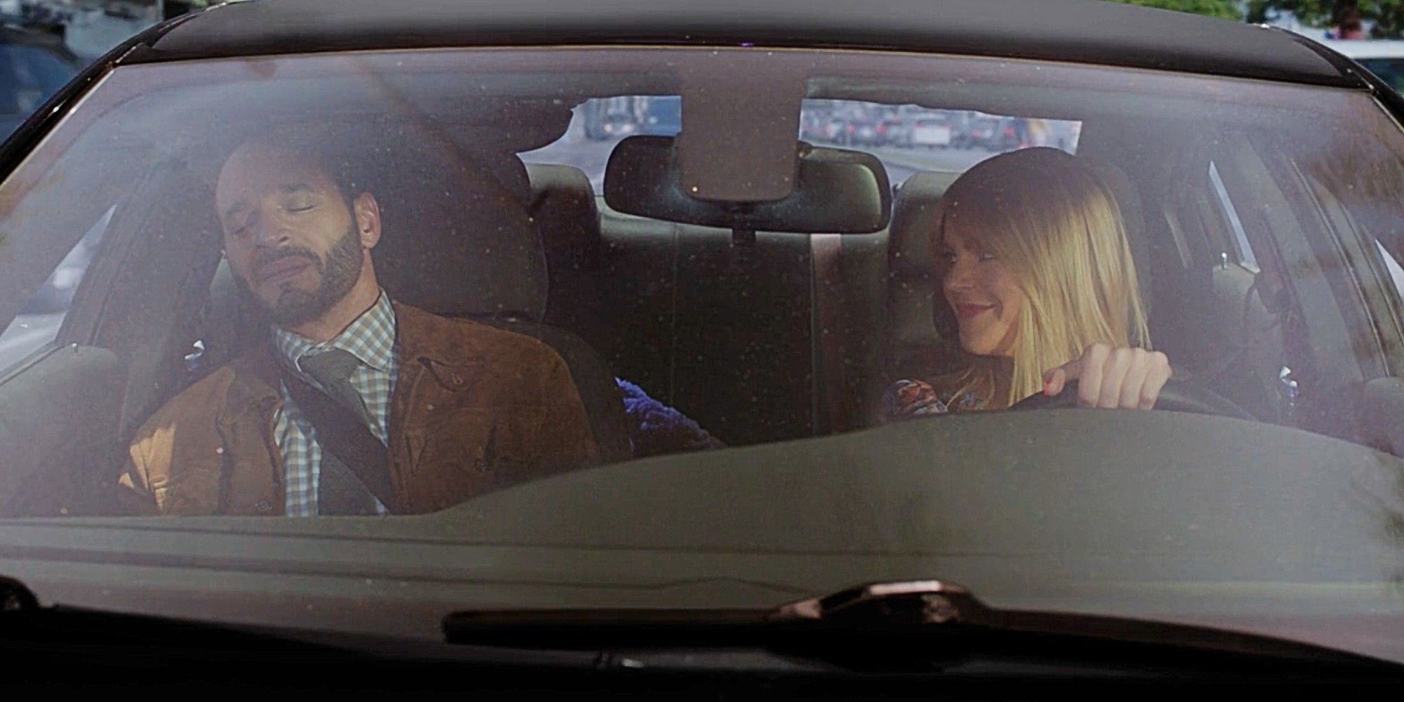 Morgan and Karadec riding in a car together in High Potential Season 1