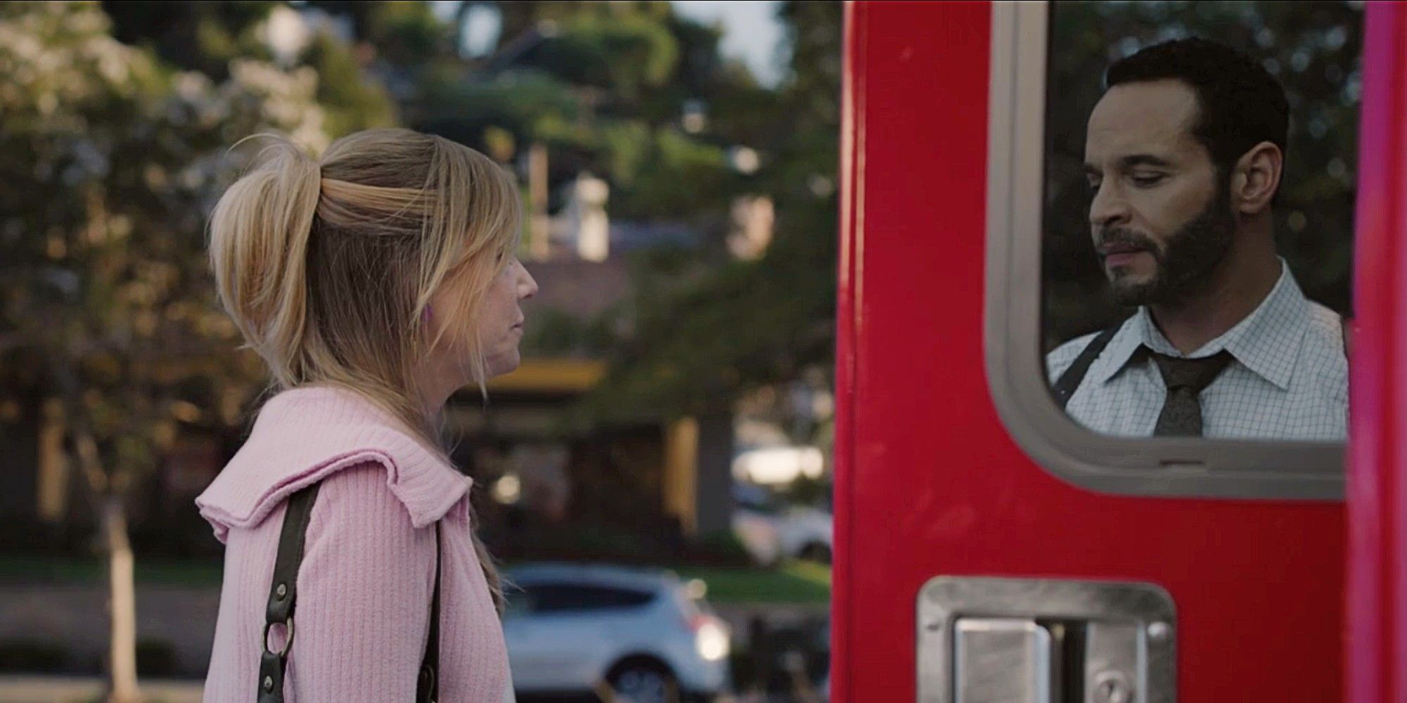 Morgan looking at Karadec through the door of an ambulance in High Potential Season 1