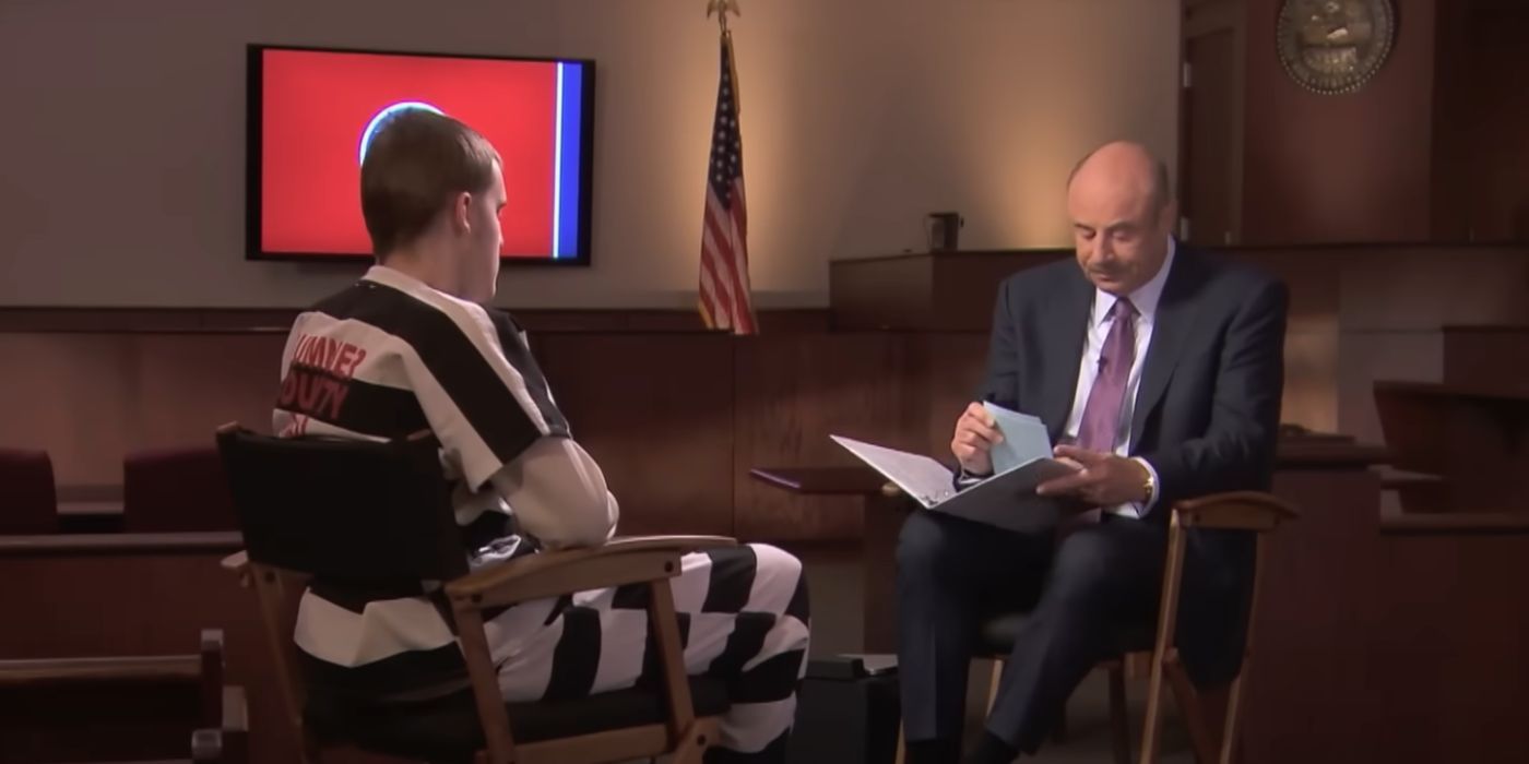 Zachary Davis in a striped prison outfit is interviewed by Dr. Phil McGraw in a small room on 'Dr. Phil'.