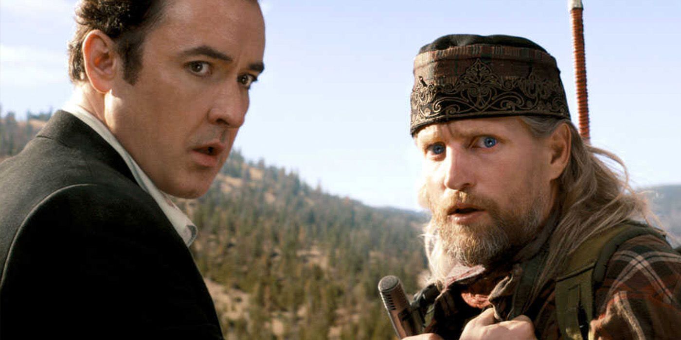 Jackson Curtis (John Cusack) grabs Charlie Frost (Woody Harrelson) as the world ends in '2012'