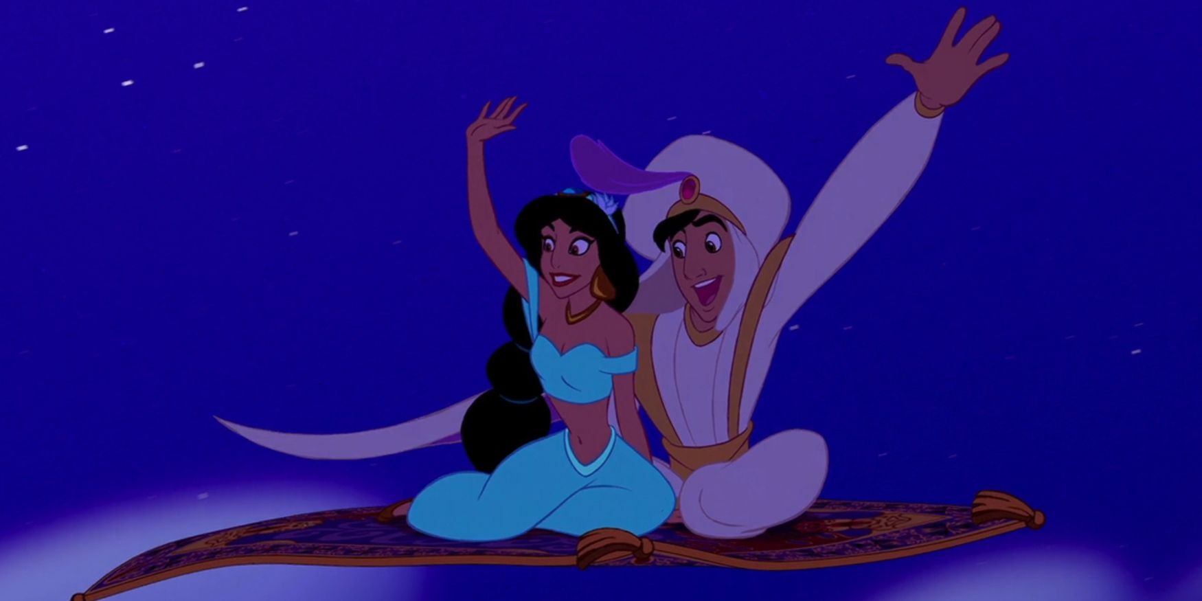 Aladdin and Jasmine wave while riding the magic carpet in 'Aladdin'.