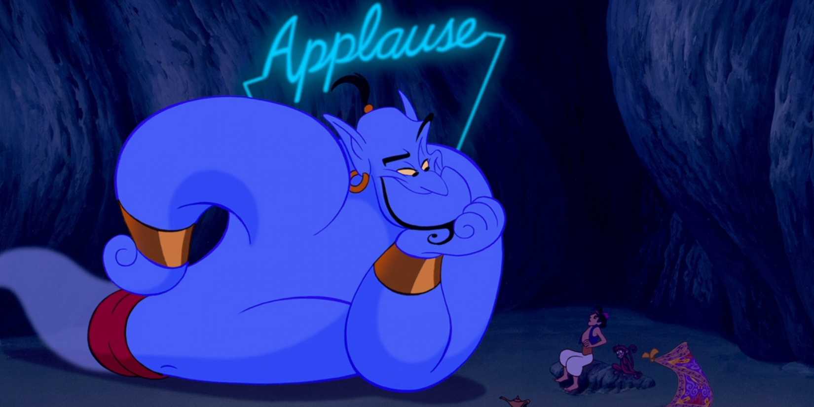 The Genie (Robin Williams) rests his head in his hand while an "Applause" sign appears above in 'Aladdin'.