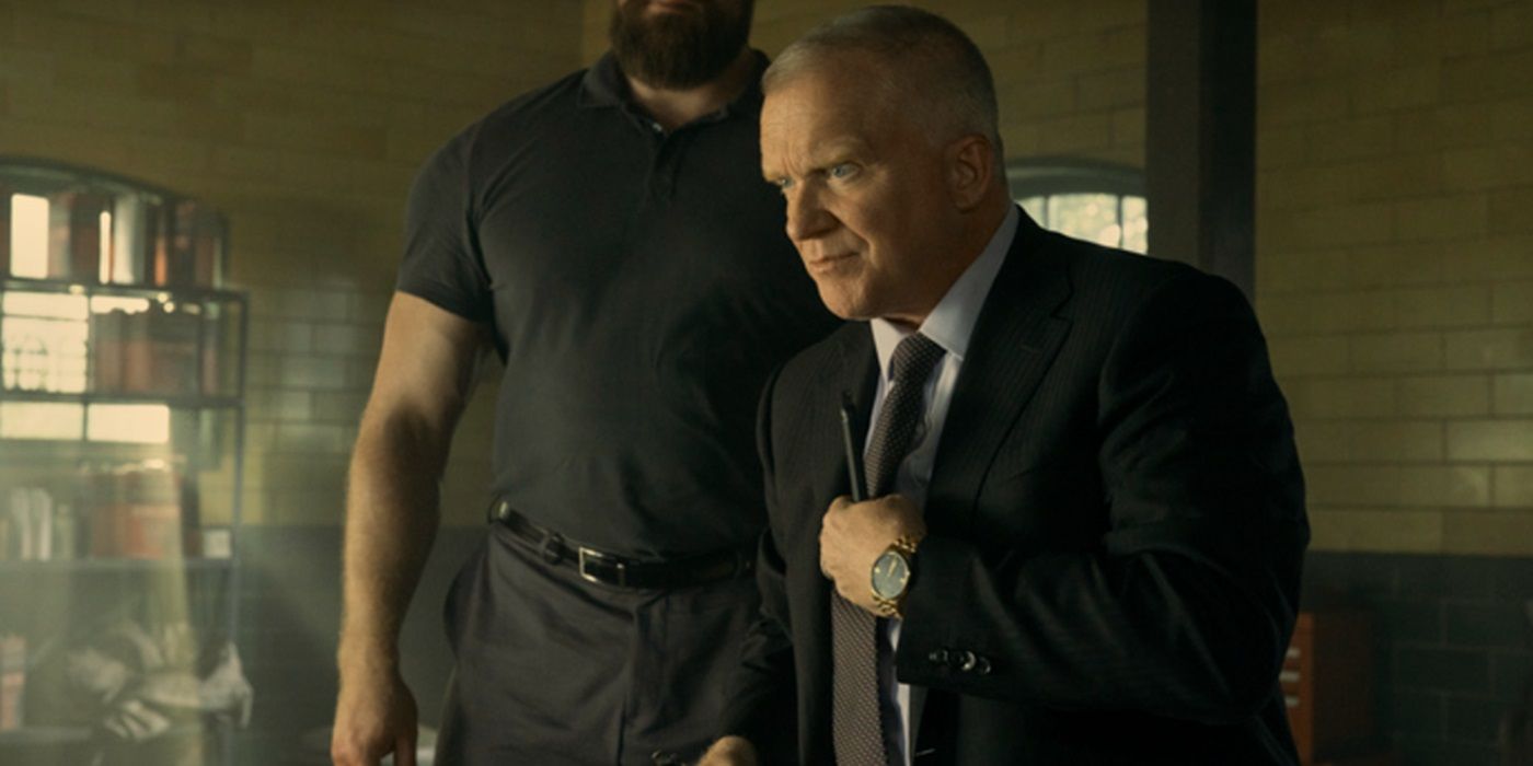 Anthony Michael Hall, holding his tie, as Zachary Beck in Reacher Season 3