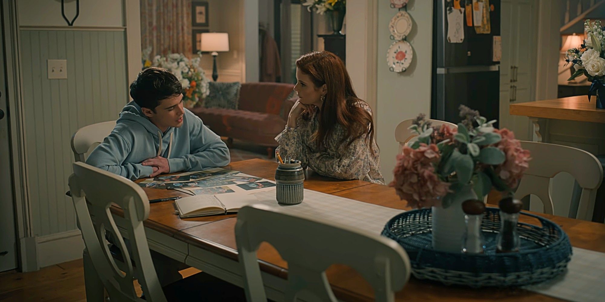 Kyle Townsend and Maddie Townsend sitting at the kitchen table together in Sweet Magnolias Season 4