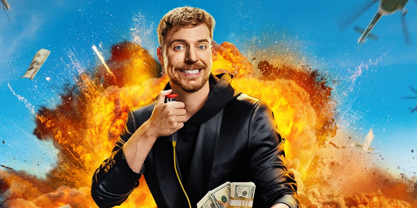 MrBeast smiling holding a detonator in one hand and cash in the other with an explosion for &lsquo;Beast Games&rsquo;