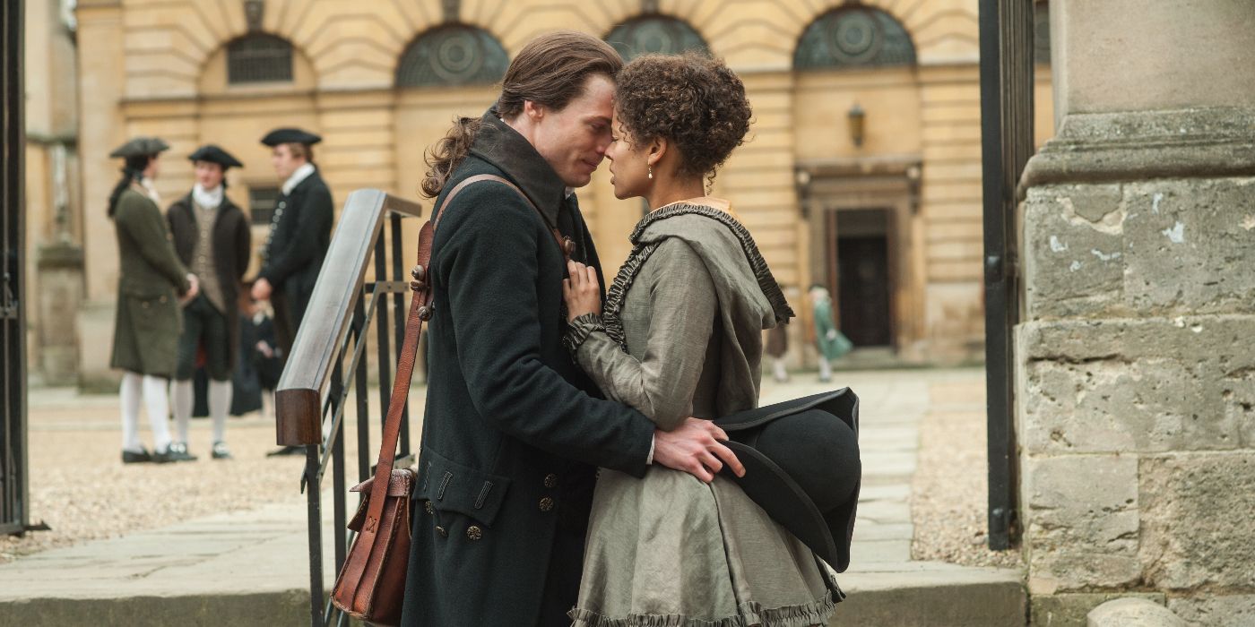 Dido (Gugu Mbatha-Raw) and John (Sam Reid) embracing with their foreheads pressed together in Belle