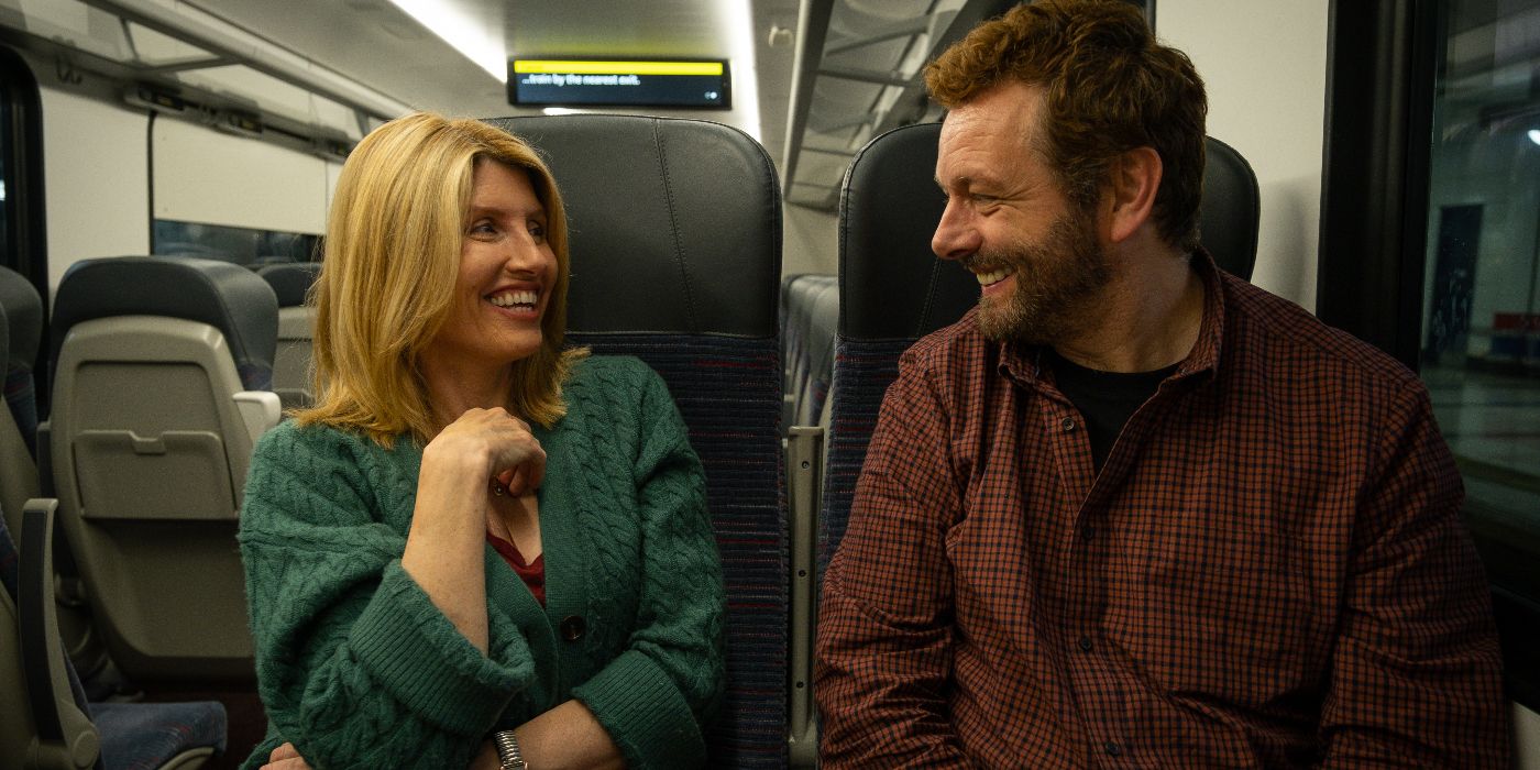 Sharon Horgan and Michael Sheen sitting on a train