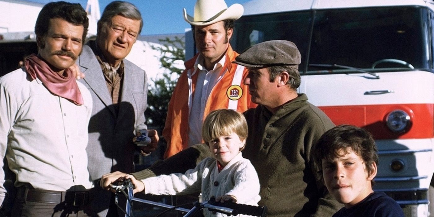 John Wayne with his sons Michael Wayne, Patrick Wayne, and Ethan Wayne, grandson Michael Ian, and Everett Creach during a break from filming &lsquo;Big Jake&rsquo; (1971)
