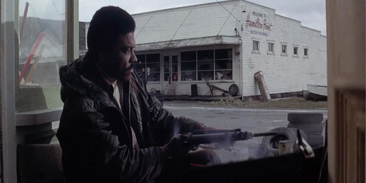 Billy Dee Williams firing a machine gun in Hit!