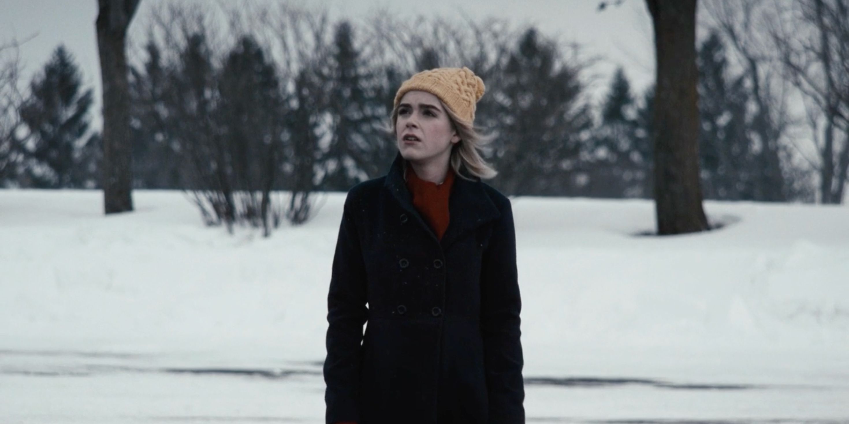 Kiernan Shipka as Kat standing in the snow in The Blackcoat's Daughter