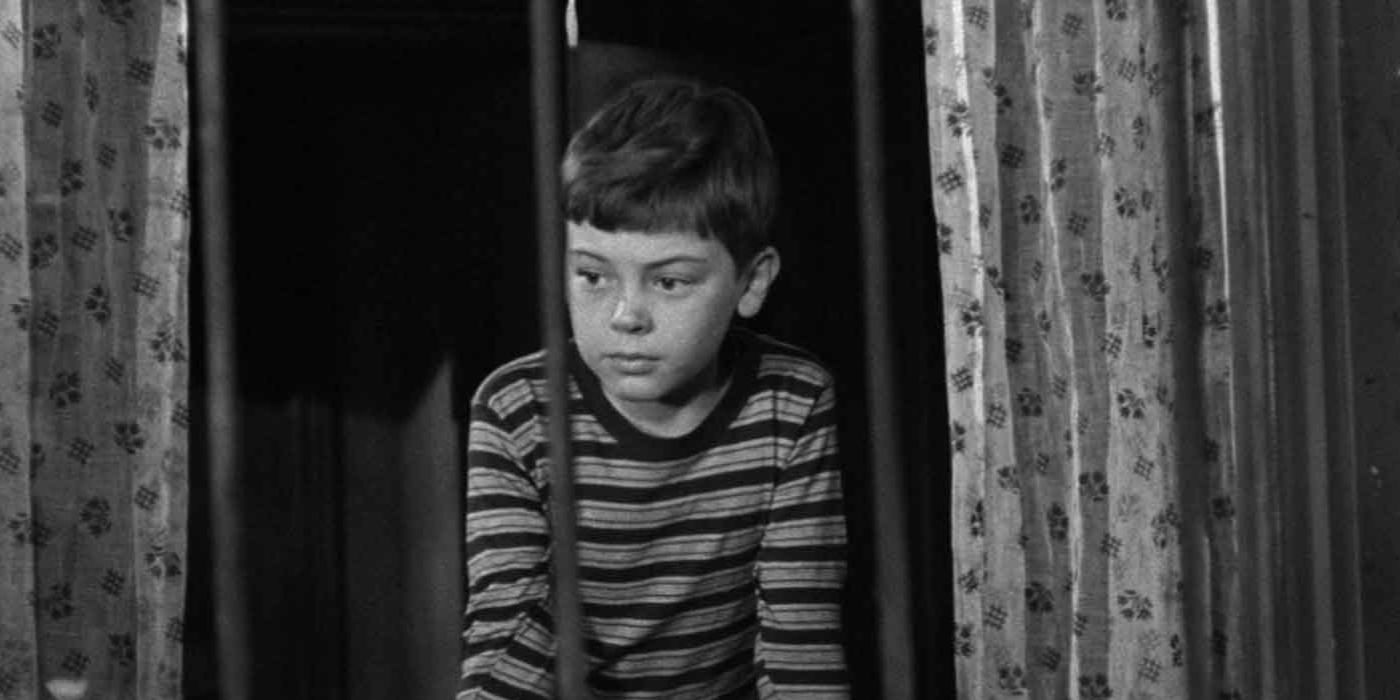 Tommy (Bobby Driscoll) looking out a window in The Window