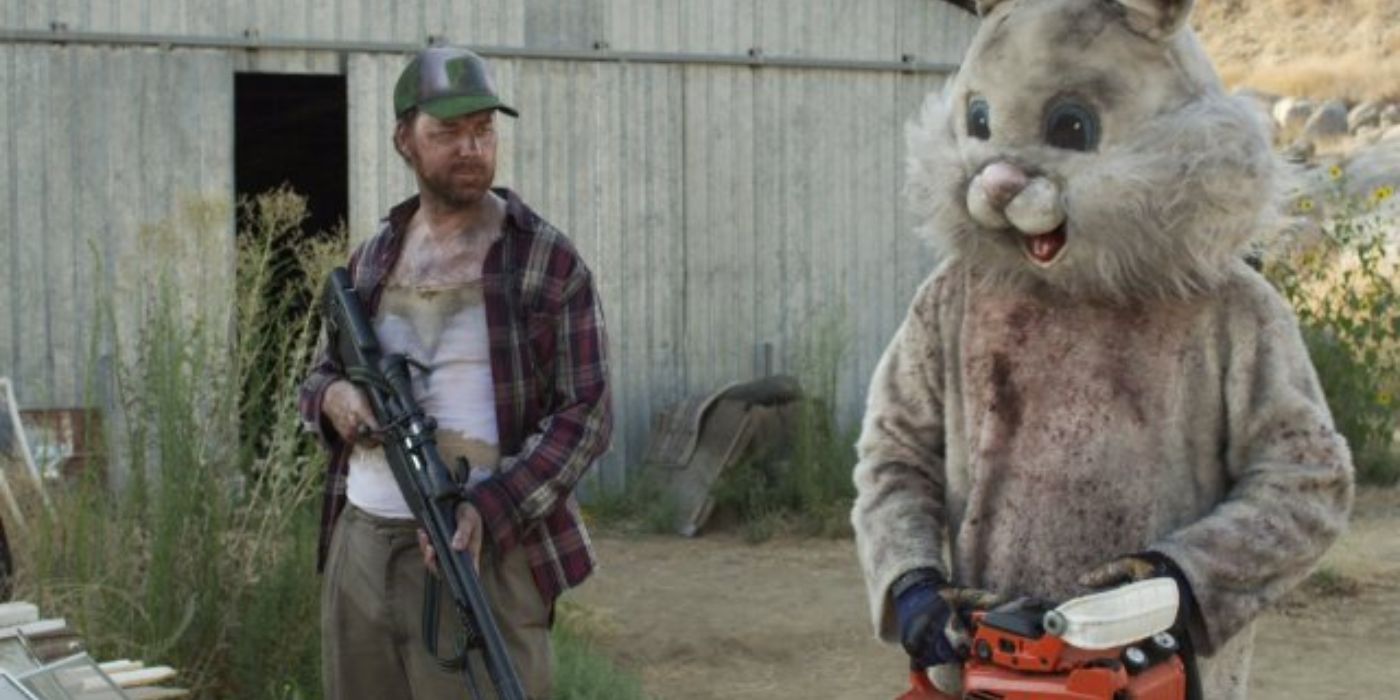 Joe (David Scott) and Bunnyman (Joshua Lang) stand with their weapons in The Bunnyman Massacre.
