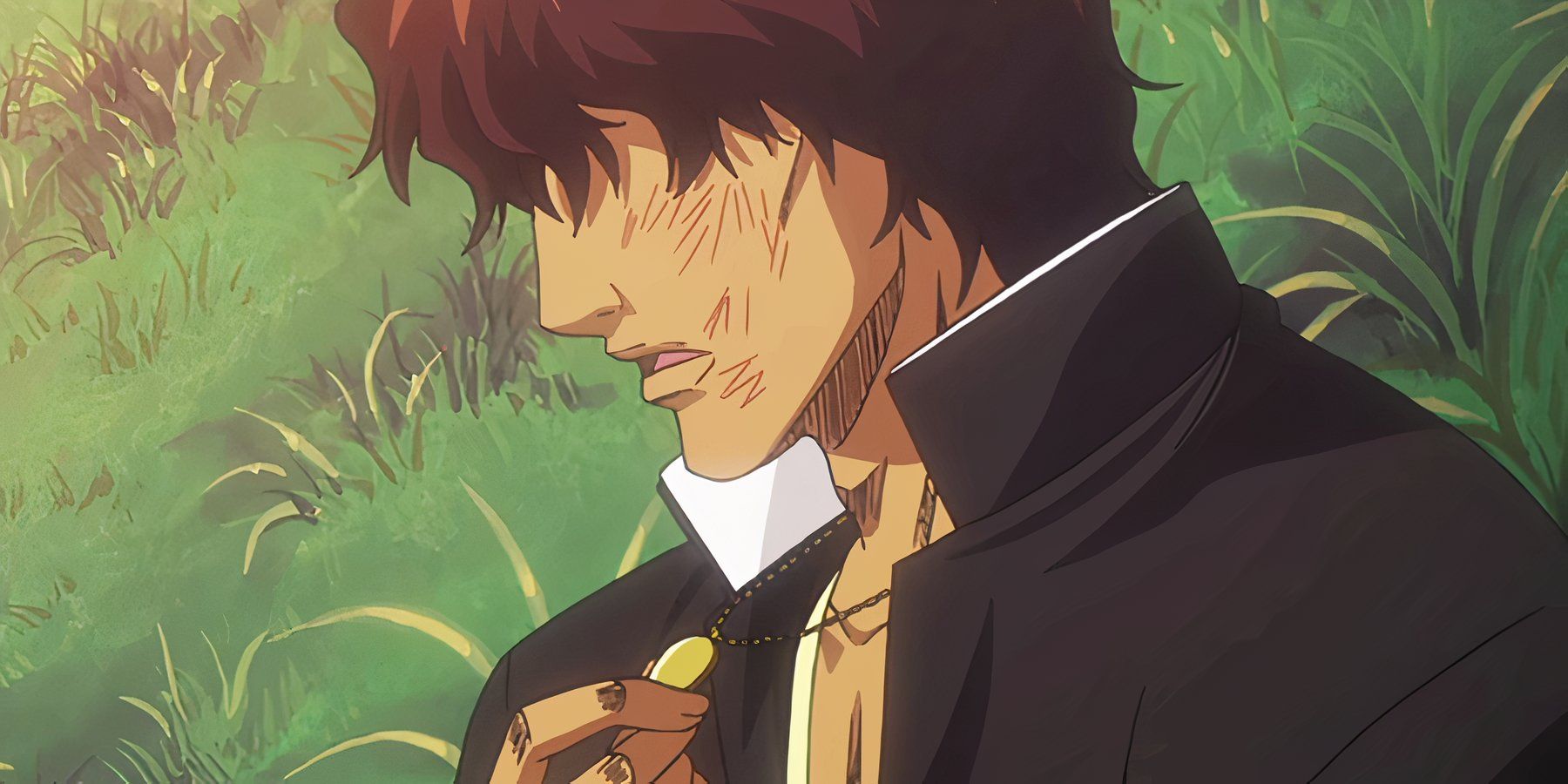 A bruised Chad touches his necklace tenderly in the anime series Bleach.
