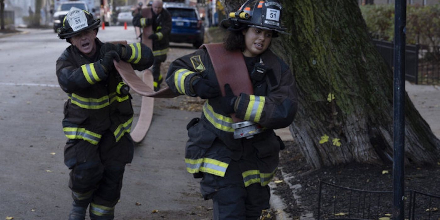 Christopher Herrmann (David Eigenberg) and Kylie Estevez (Katelynn Shennett) drag hoses to the nearest fire hydrant in Chicago Fire's "Relief Cut"